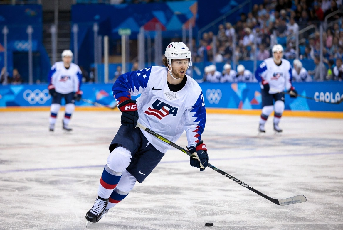 Team USA players hold Johnny Gaudreau No. 13 jersey during 2026 Winter Olympics gold medal celebration
