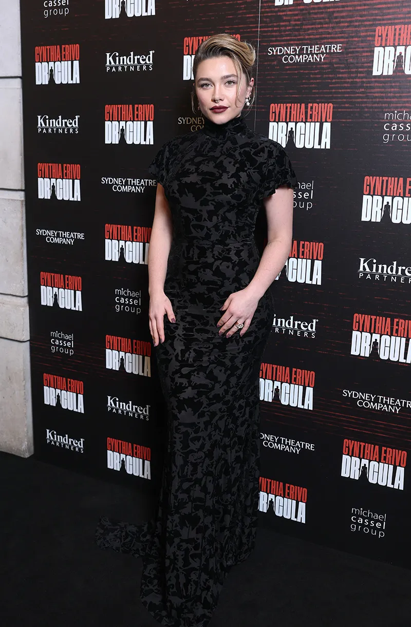 Florence Pugh wearing a floor-length black Patou Fall 2026 velvet dress with a mock neck at the Dracula opening in London.